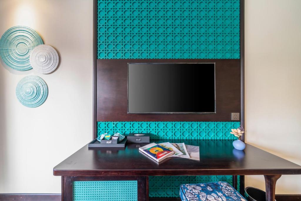 TV a/nebo společenská místnost v ubytování De An Hotel