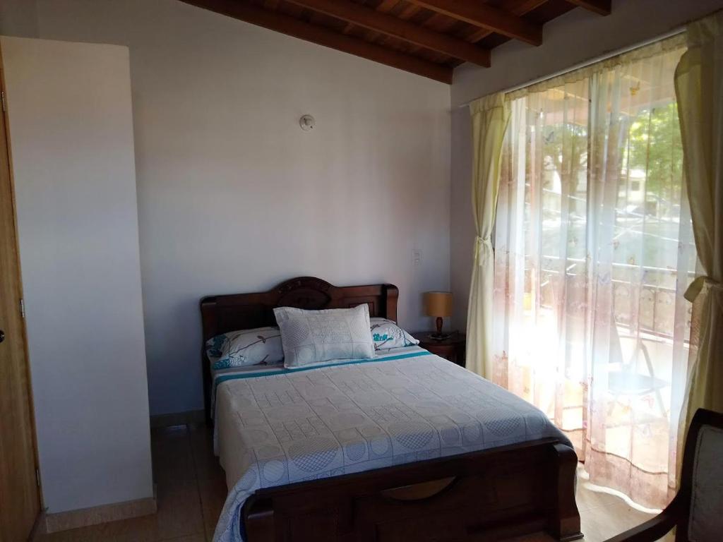 Postel nebo postele na pokoji v ubytování Mayorca Homestay