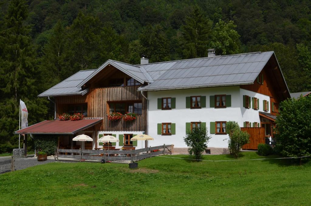 a large white house with a gambrel roof at Haseltopf in Oberstdorf