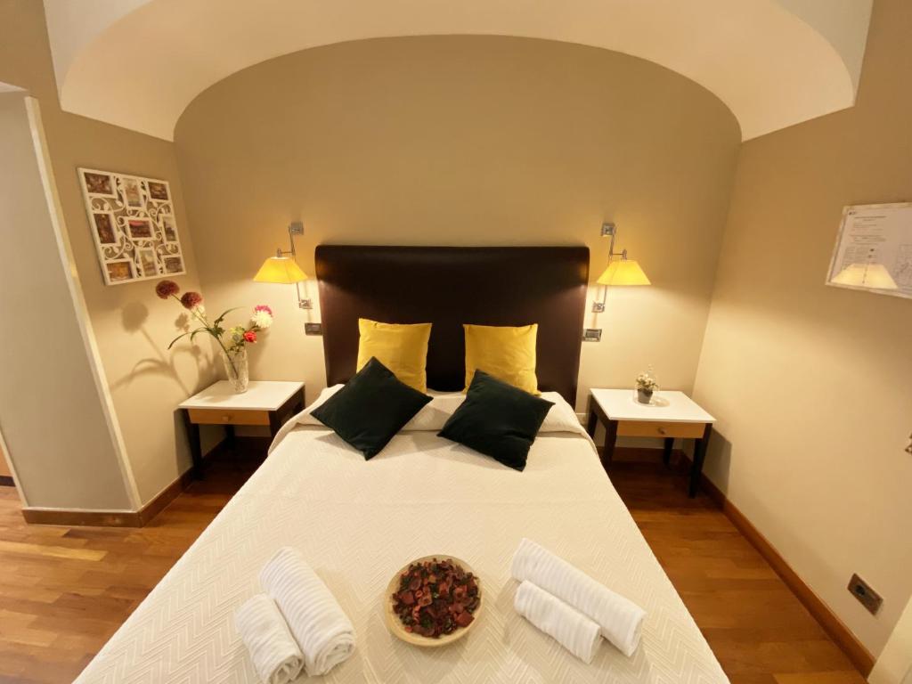 Postel nebo postele na pokoji v ubytování Hotel Giolitti