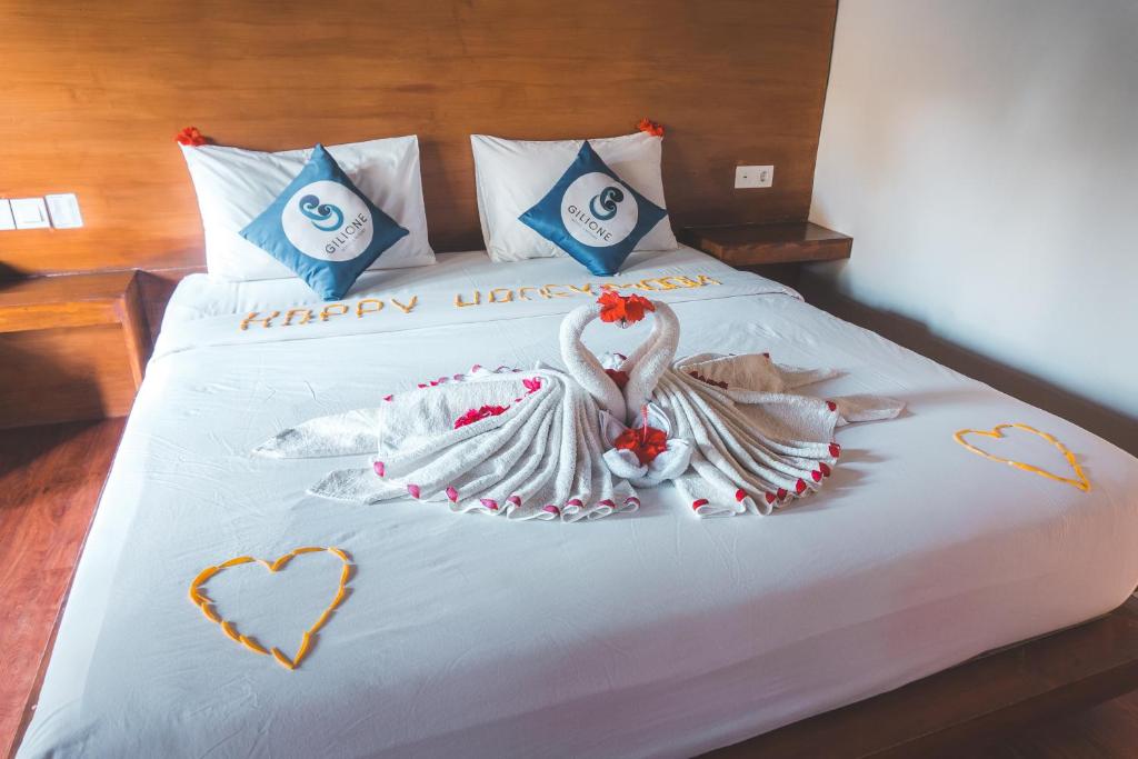 Letto o letti in una camera di Gili One Resort