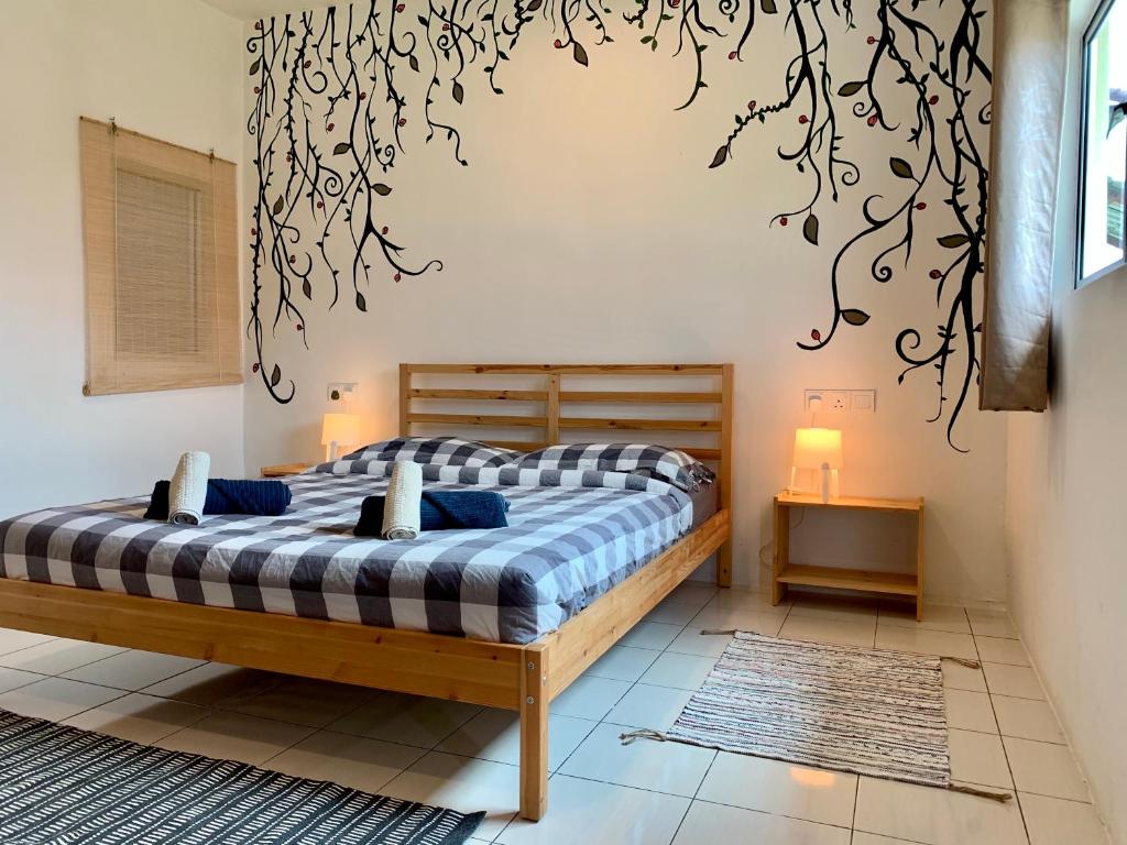 Postel nebo postele na pokoji v ubytování Kawah Padi Garden Villa Langkawi