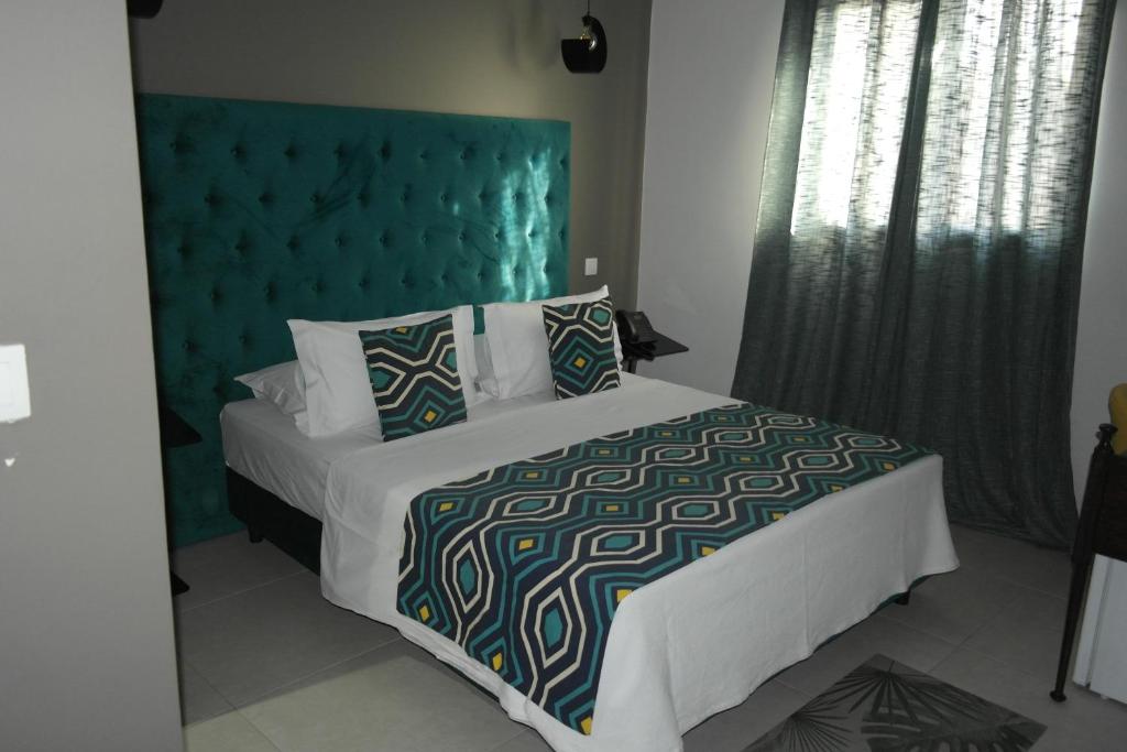 Postel nebo postele na pokoji v ubytování Aparthotel Palace