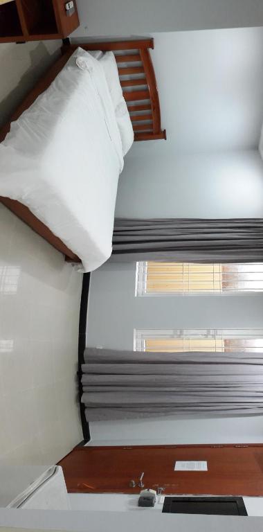 Postel nebo postele na pokoji v ubytování DoDo Guesthouse