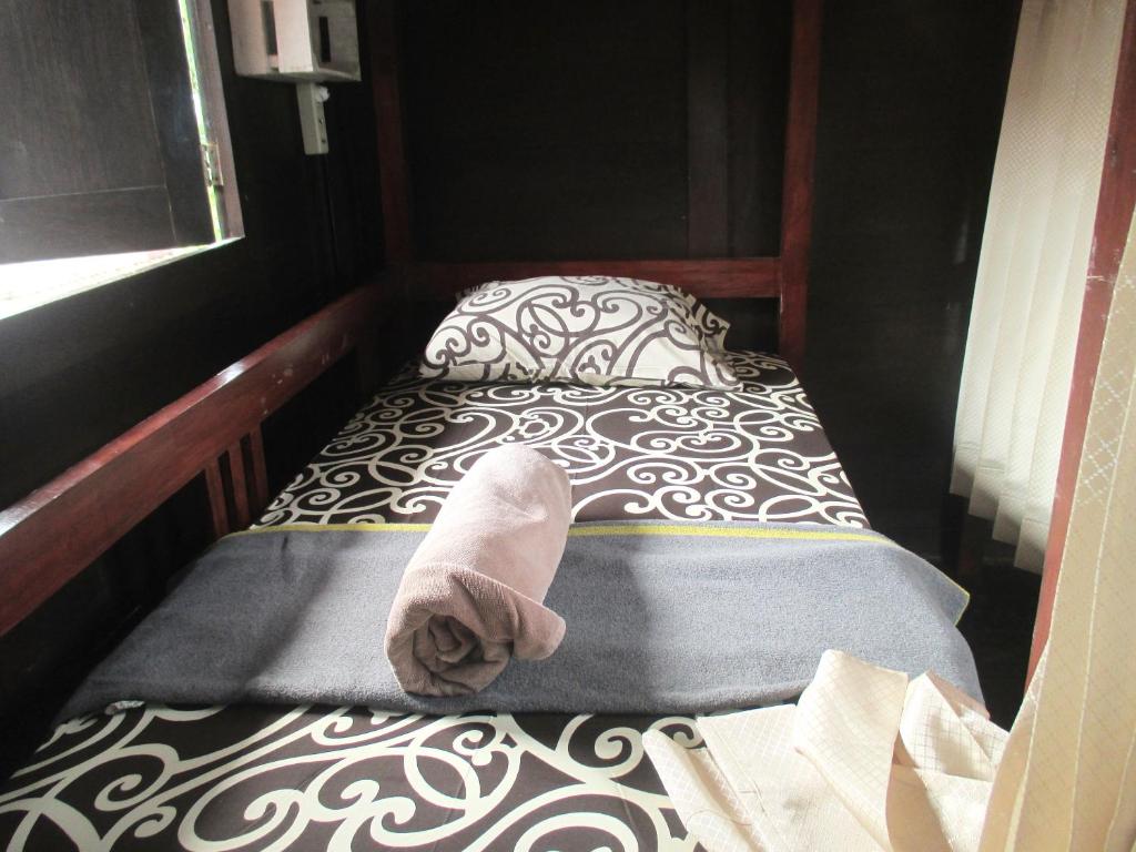 Postel nebo postele na pokoji v ubytování Green Paddy Hostel & Villa
