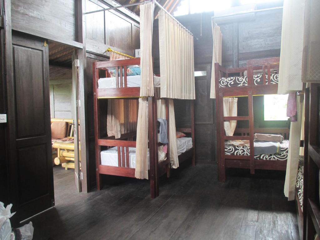 Postel nebo postele na pokoji v ubytování Green Paddy Hostel & Villa