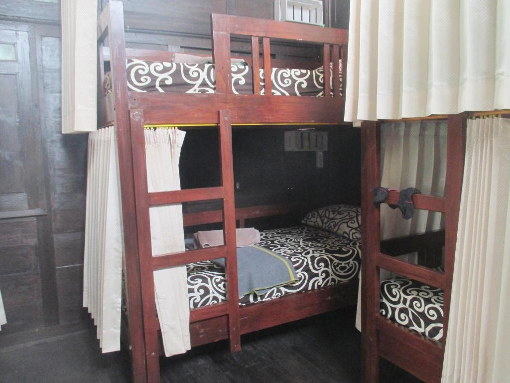 Postel nebo postele na pokoji v ubytování Green Paddy Hostel & Villa