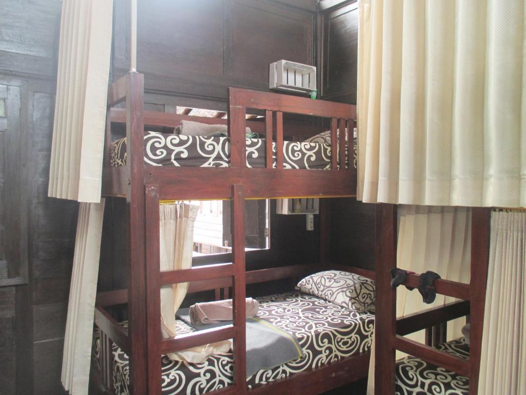 Postel nebo postele na pokoji v ubytování Green Paddy Hostel & Villa