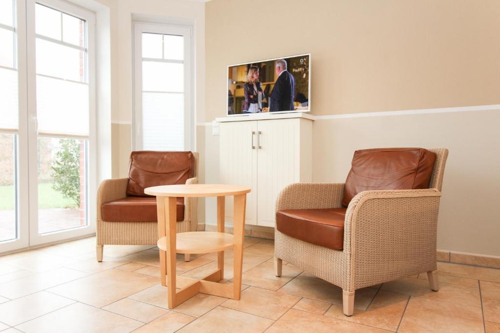 TV a/nebo společenská místnost v ubytování Logierhaus-Greetsiel S