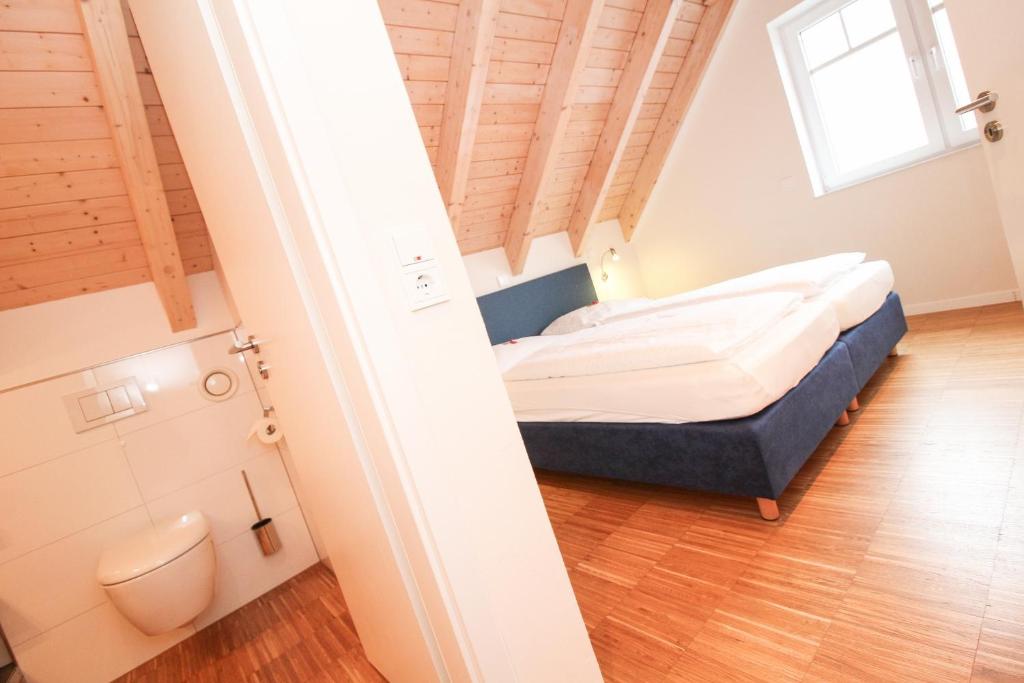 Postel nebo postele na pokoji v ubytování Logierhaus-Greetsiel 1