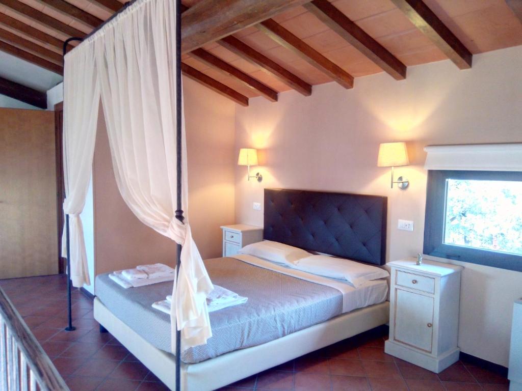 Postel nebo postele na pokoji v ubytování Toscana Verde