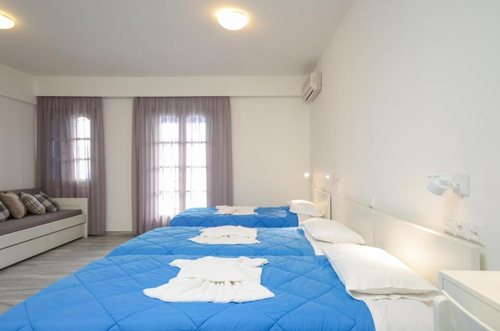 A bed or beds in a room at Soula Naxos