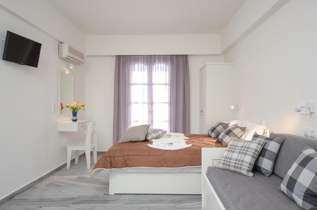 A bed or beds in a room at Soula Naxos