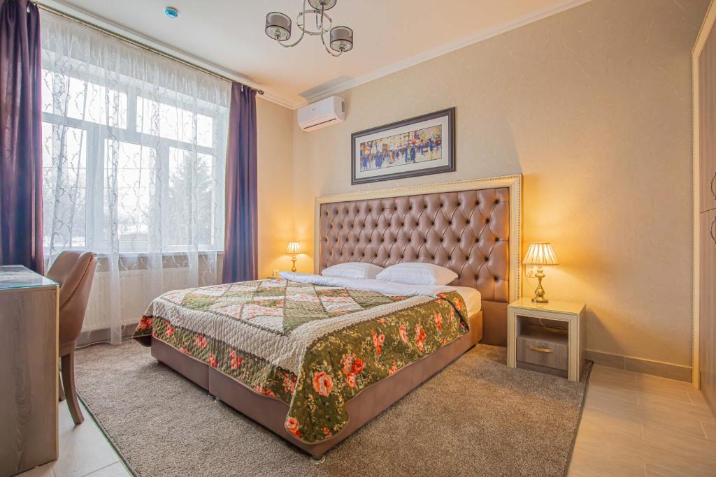 Кровать или кровати в номере Мини-отель "В Ростове Жить"