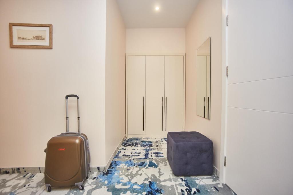 Postel nebo postele na pokoji v ubytování Jupiter Hotel