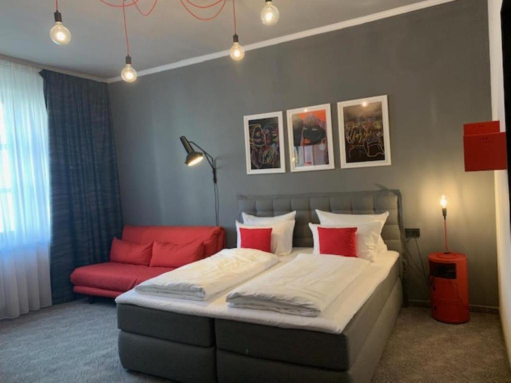 Postel nebo postele na pokoji v ubytování Hotel Maxplatz