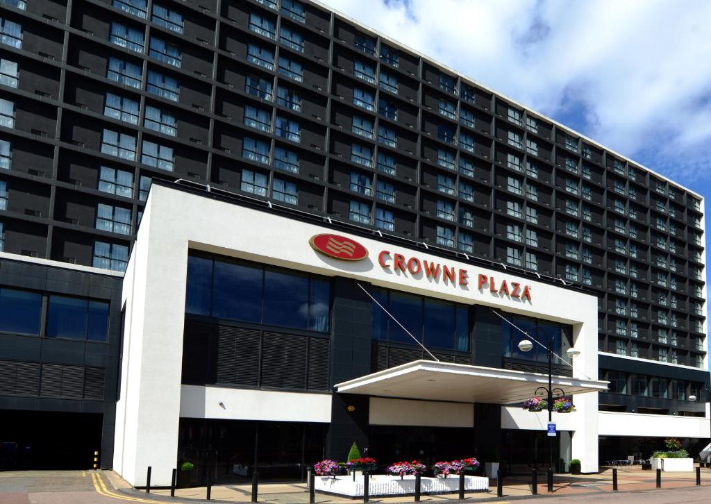 
a large building with a large sign on the side of it at Crowne Plaza Birmingham City, an IHG Hotel in Birmingham
