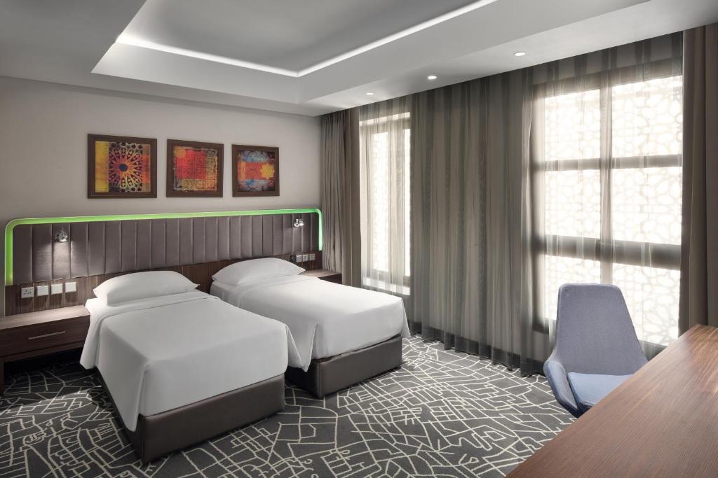 Postel nebo postele na pokoji v ubytování Park Inn by Radisson Makkah Aziziyah