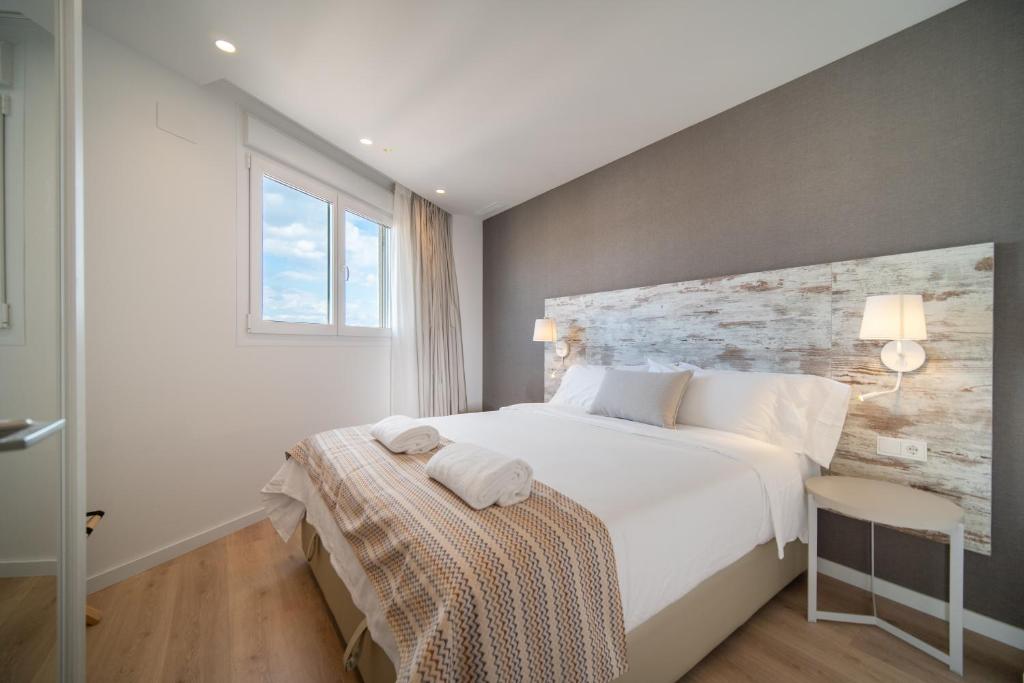 Postel nebo postele na pokoji v ubytování Ahoy Apartments