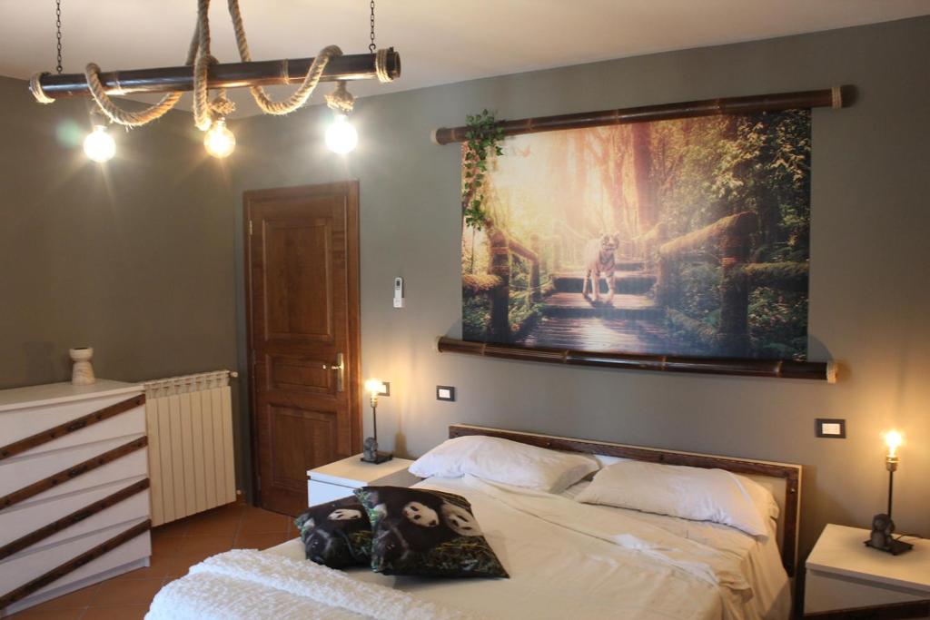 Postel nebo postele na pokoji v ubytování Il Granaio Del Pavone