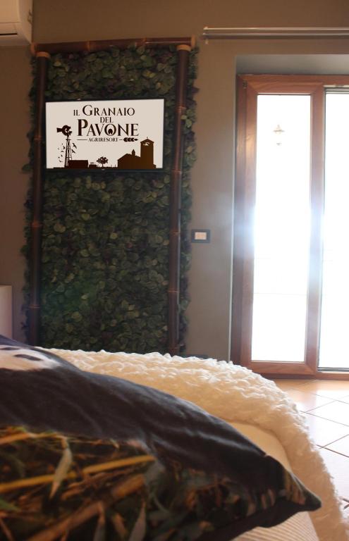Postel nebo postele na pokoji v ubytování Il Granaio Del Pavone