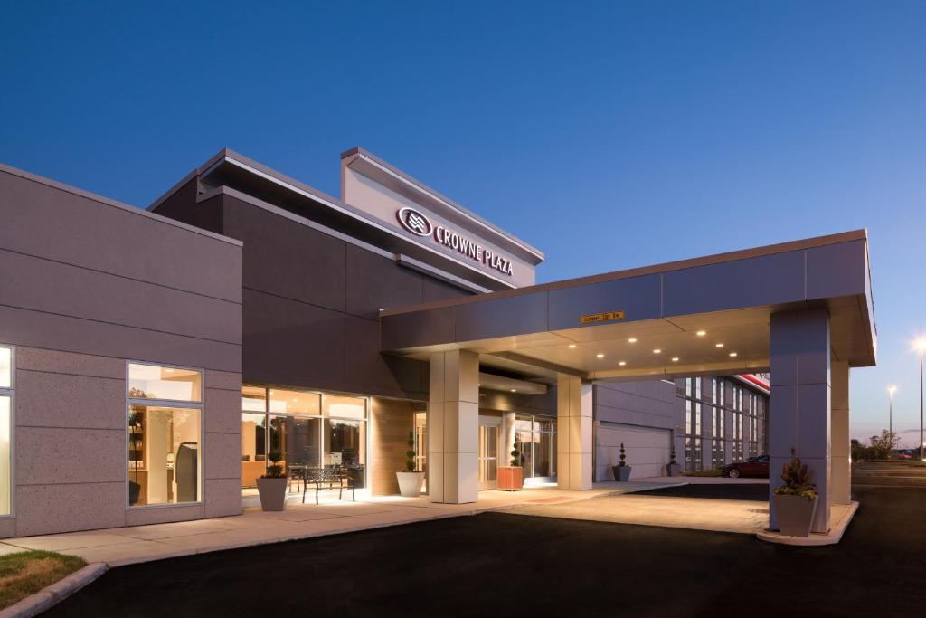 a building with a sign on the front of it at Crowne Plaza Chicago SW - Burr Ridge, an IHG Hotel in Burr Ridge