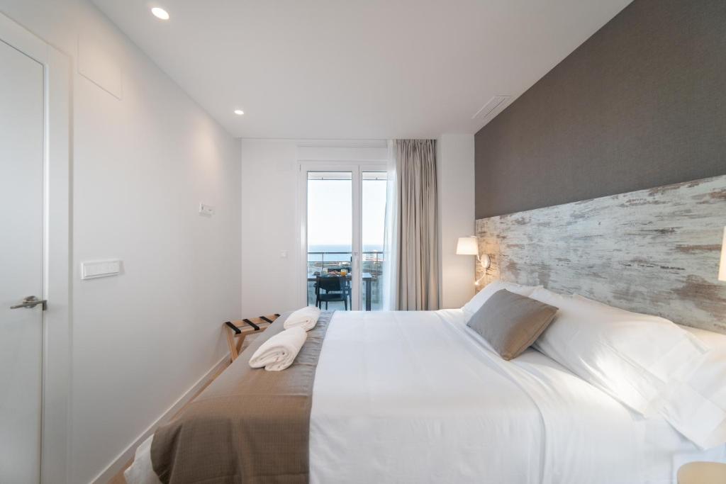 Postel nebo postele na pokoji v ubytování Ahoy Apartments