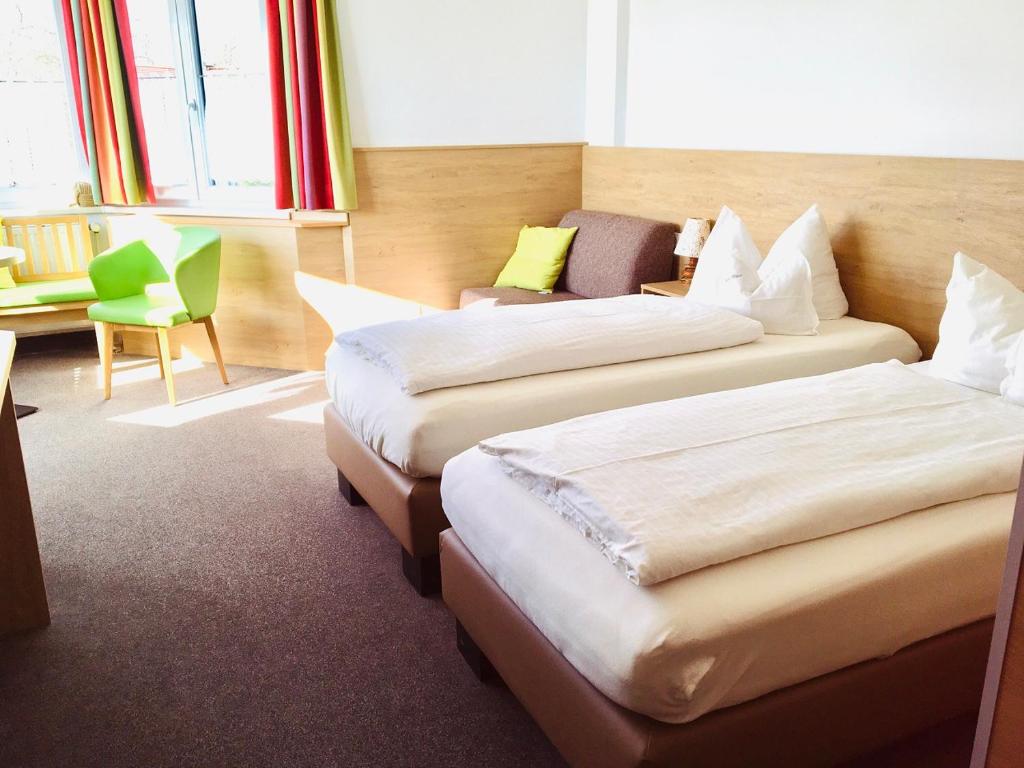 Postel nebo postele na pokoji v ubytování Isar Hotel