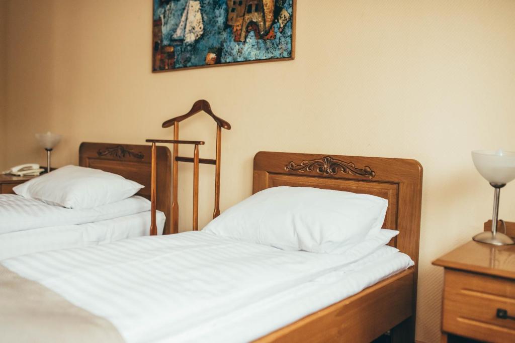 Postel nebo postele na pokoji v ubytování Lyube