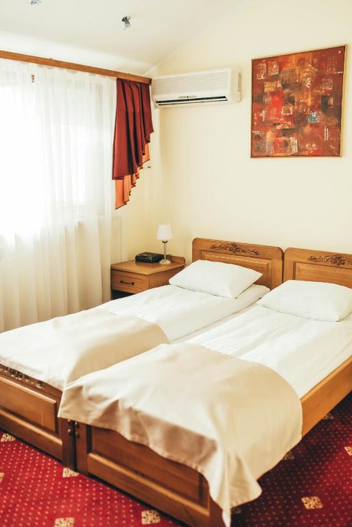Postel nebo postele na pokoji v ubytování Lyube