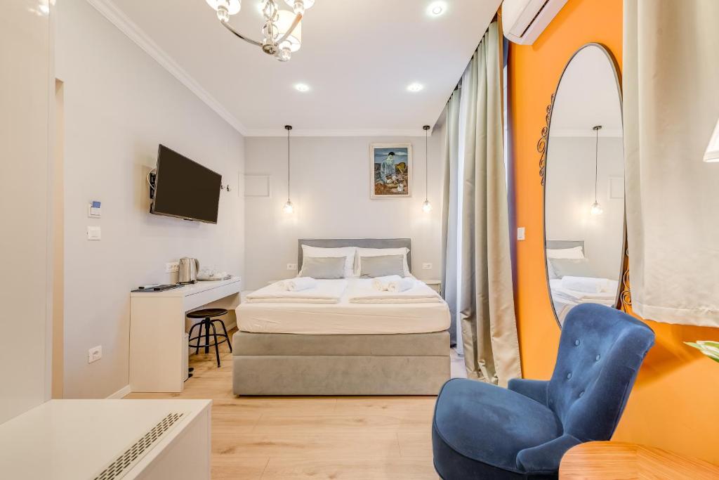 Postel nebo postele na pokoji v ubytování Piano Suites