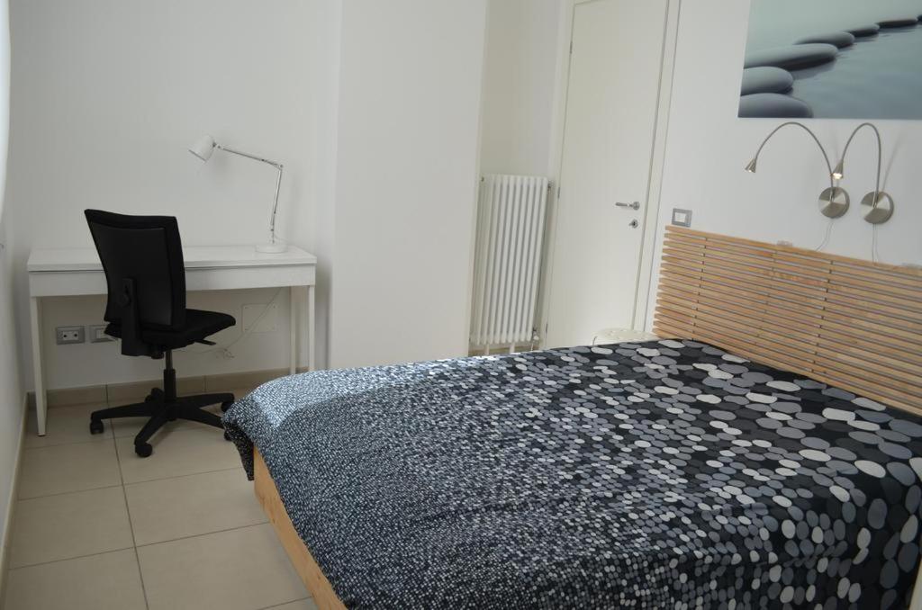 A bed or beds in a room at White Dream Spotorno