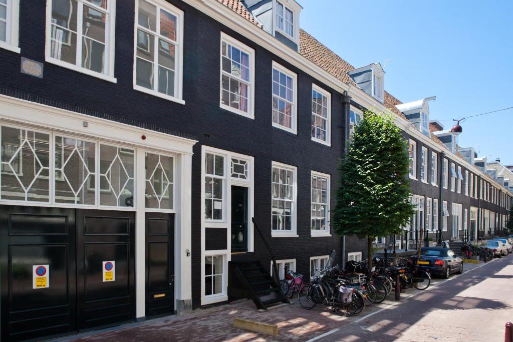 a black building with bikes parked in front of it at Luna's Hideaway in Amsterdam