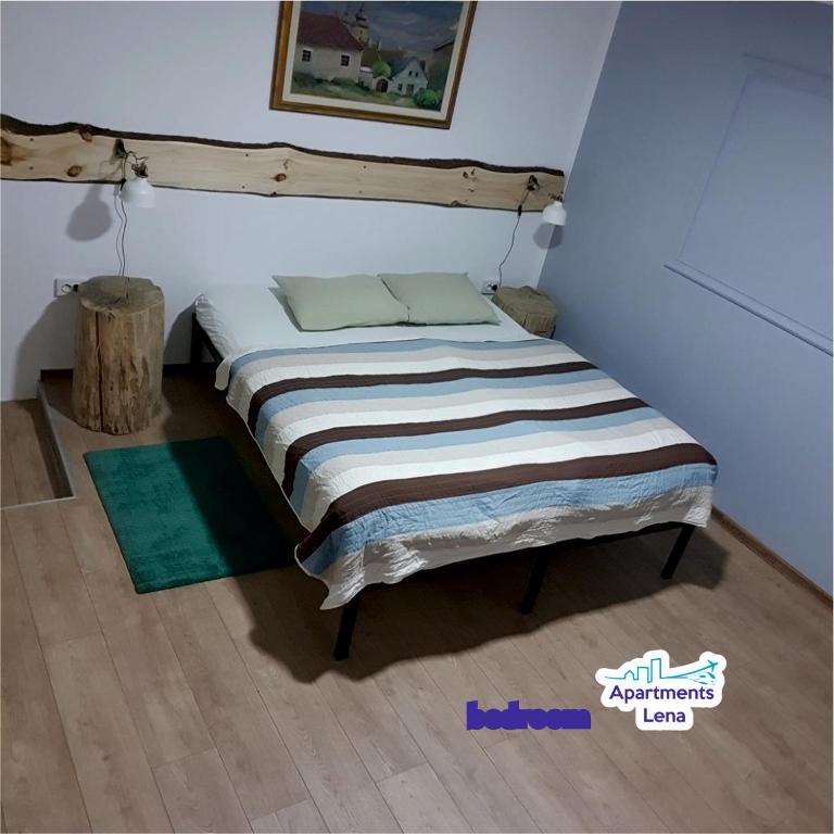 a bed in the corner of a room at Apartment Lena Centar - best value, best choice! in Osijek
