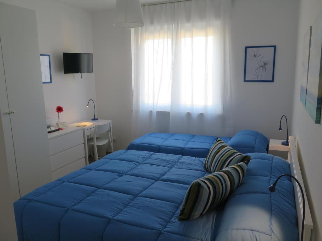 Postel nebo postele na pokoji v ubytování AnconaBed