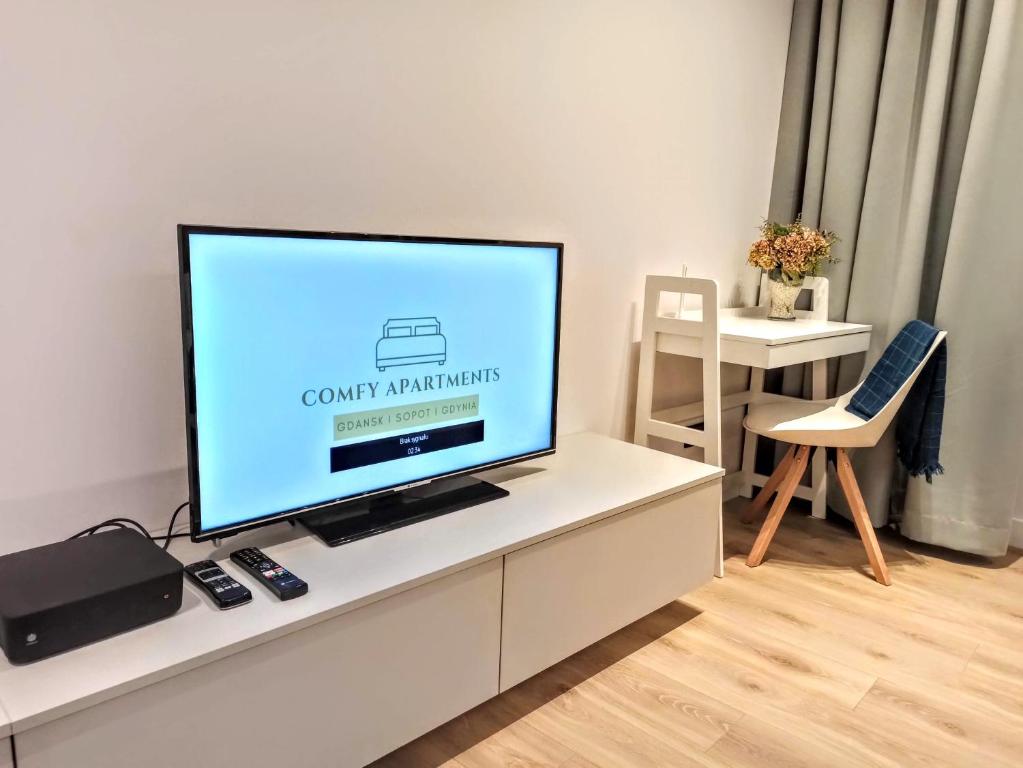 Televízia a/alebo spoločenská miestnosť v ubytovaní Comfy Apartments - Old Town Center