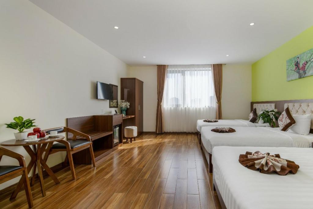 Postel nebo postele na pokoji v ubytování Tay Bac Hotel Da Nang