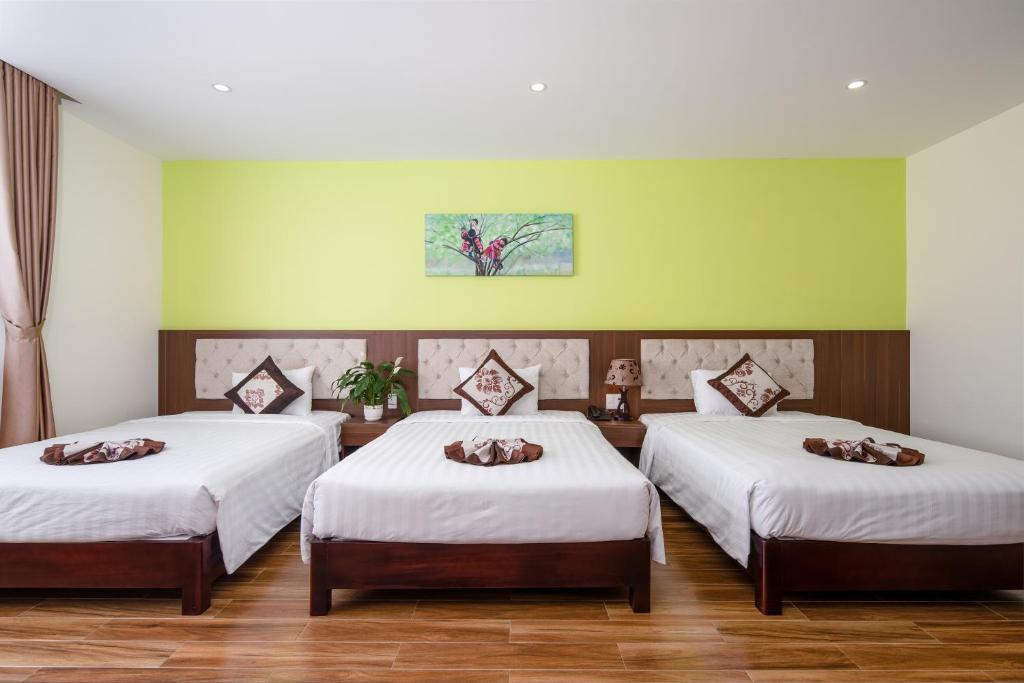 Postel nebo postele na pokoji v ubytování Tay Bac Hotel Da Nang
