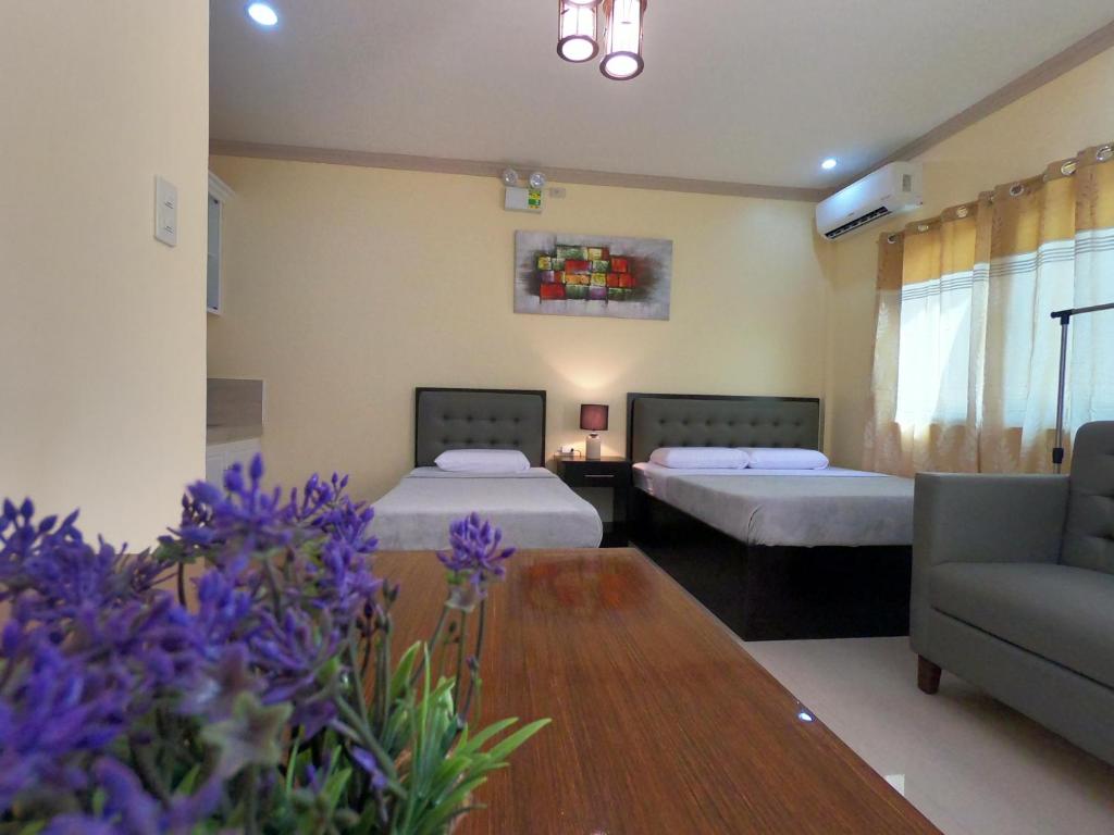 Postel nebo postele na pokoji v ubytování Mifaña Suites - Panglao Island
