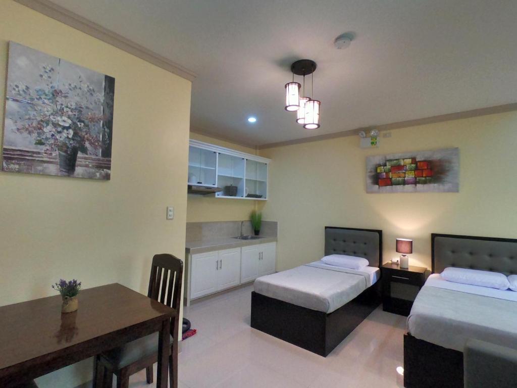 Postel nebo postele na pokoji v ubytování Mifaña Suites - Panglao Island