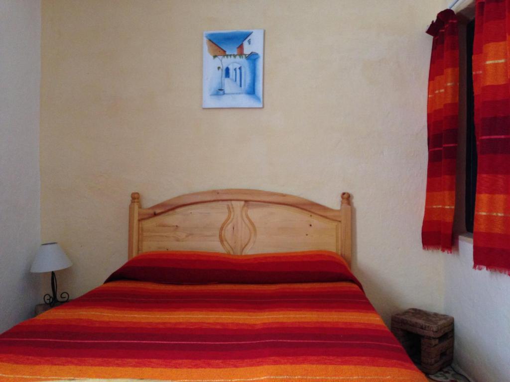 Postel nebo postele na pokoji v ubytování Dar Onsar