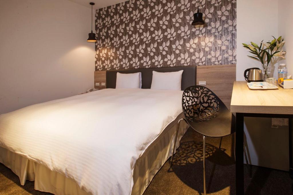 Postel nebo postele na pokoji v ubytování Queens Hotel II