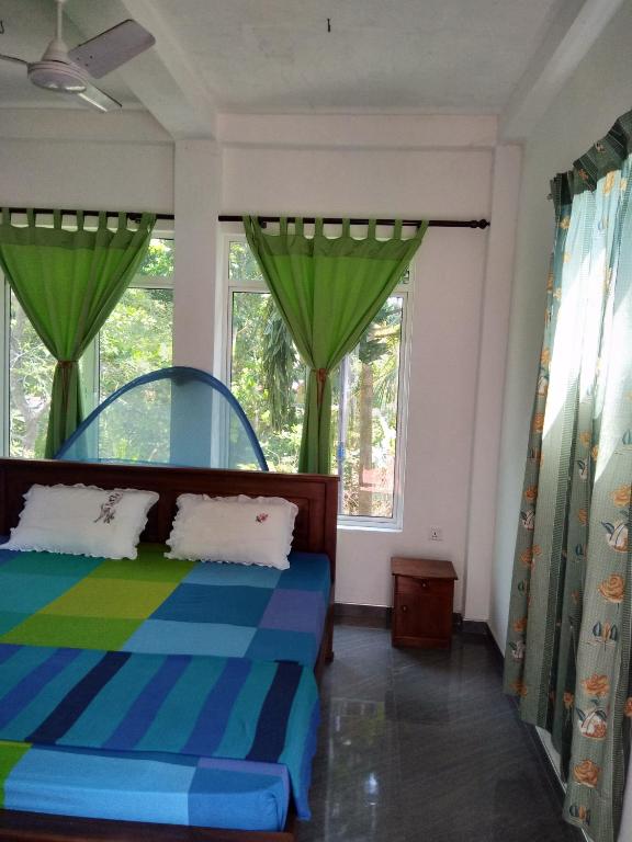 Postel nebo postele na pokoji v ubytování Mallika Resort