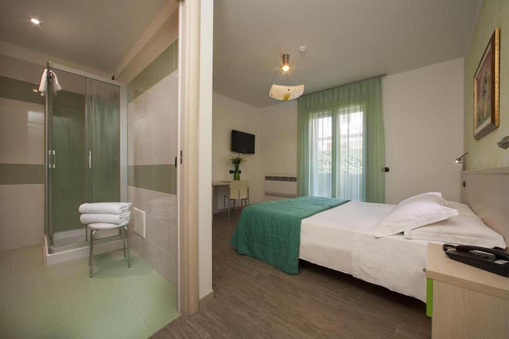 Postel nebo postele na pokoji v ubytování Albergo Antica Corte Marchesini