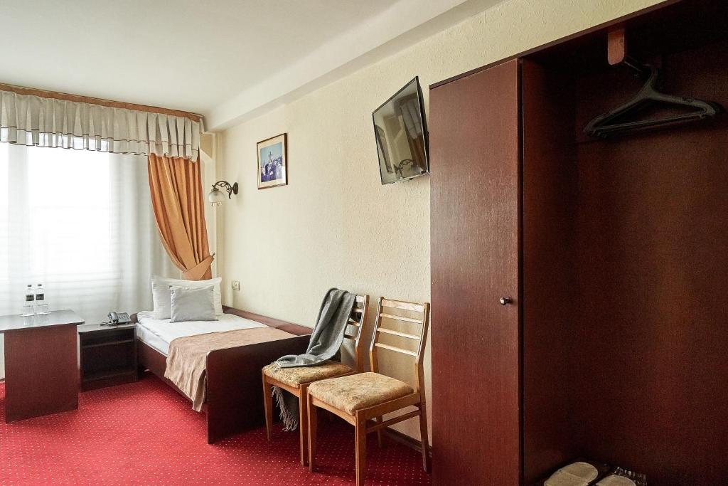 Postel nebo postele na pokoji v ubytování Hotel Druzhba
