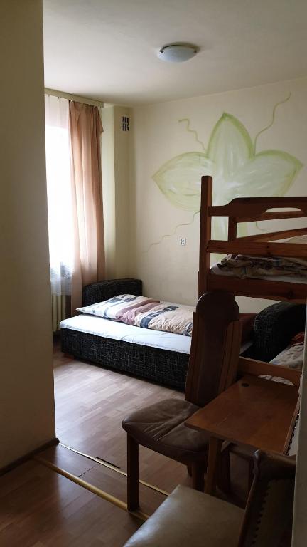 Postel nebo postele na pokoji v ubytování OKW Pilsko