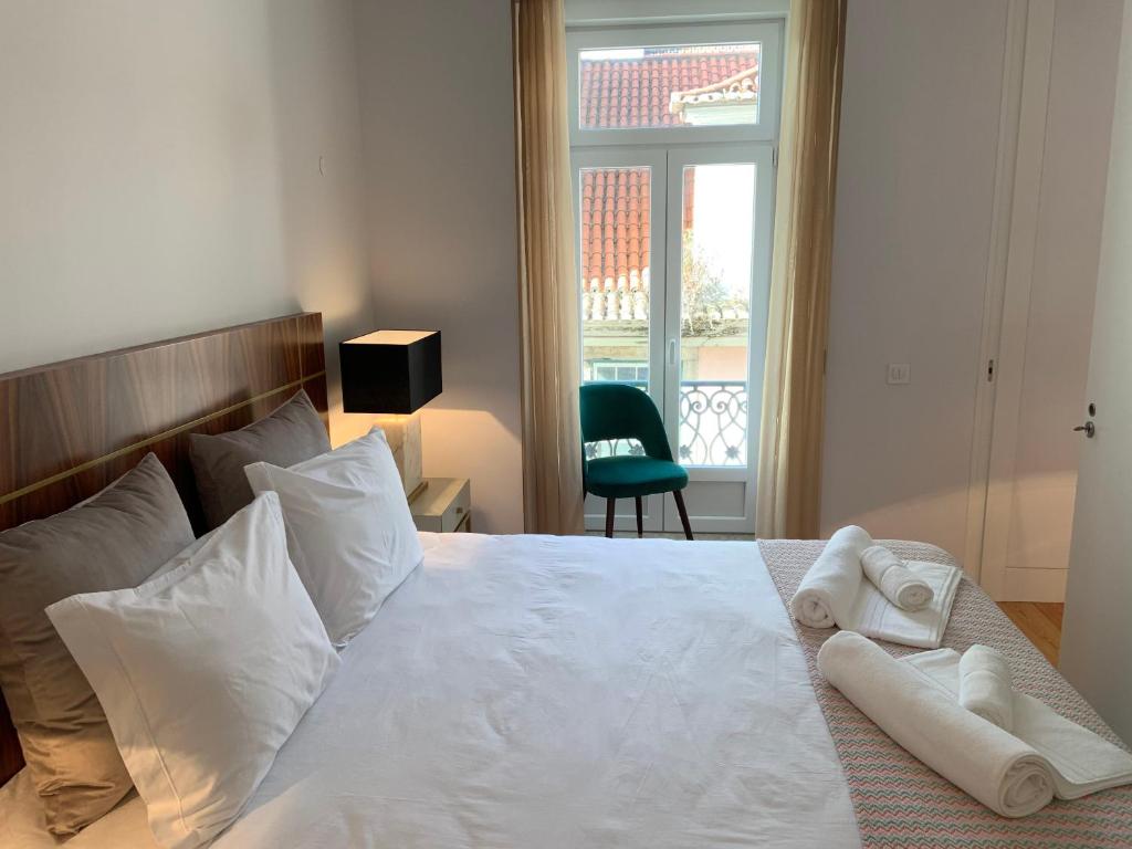 Postel nebo postele na pokoji v ubytování My Fair Lisbon - Deluxe Modern Apartment in Baixa Pombalina