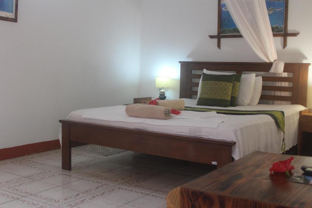 Postel nebo postele na pokoji v ubytování Zerof Guest House