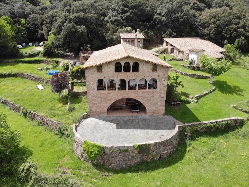 an aerial view of a house in a field at Casa Rural El Callís in Vall de Bianya