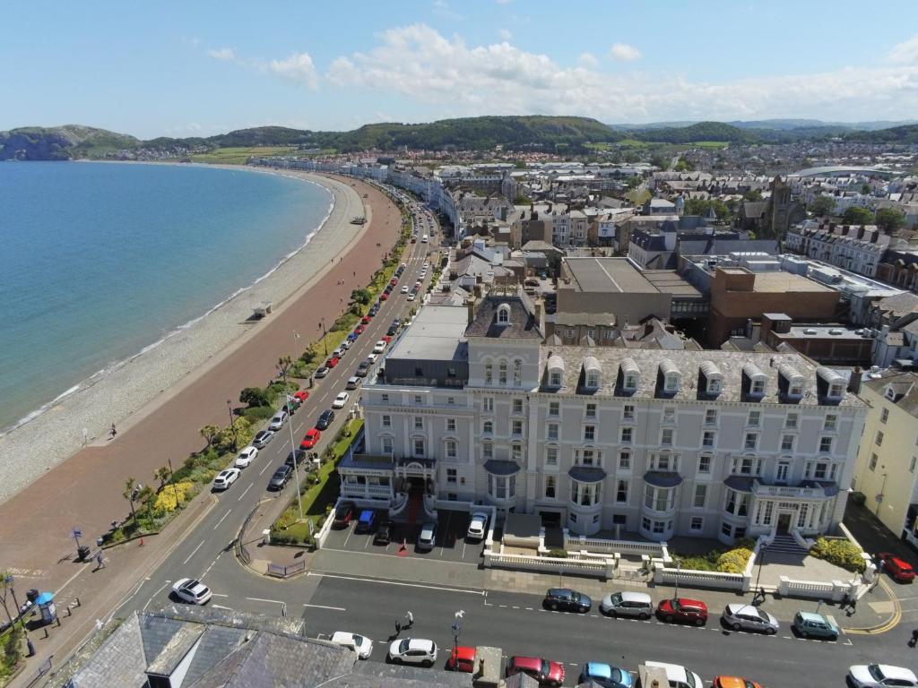 an aerial view of a city and the beach at St George's Hotel - Llandudno in Llandudno